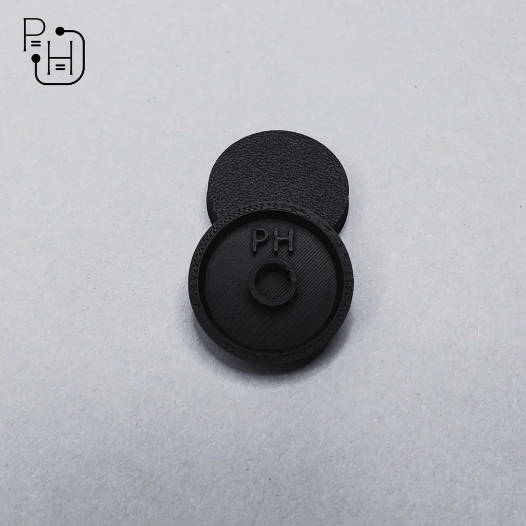 Black 3D printed wargaming base with PH logo, textured surface for miniature models