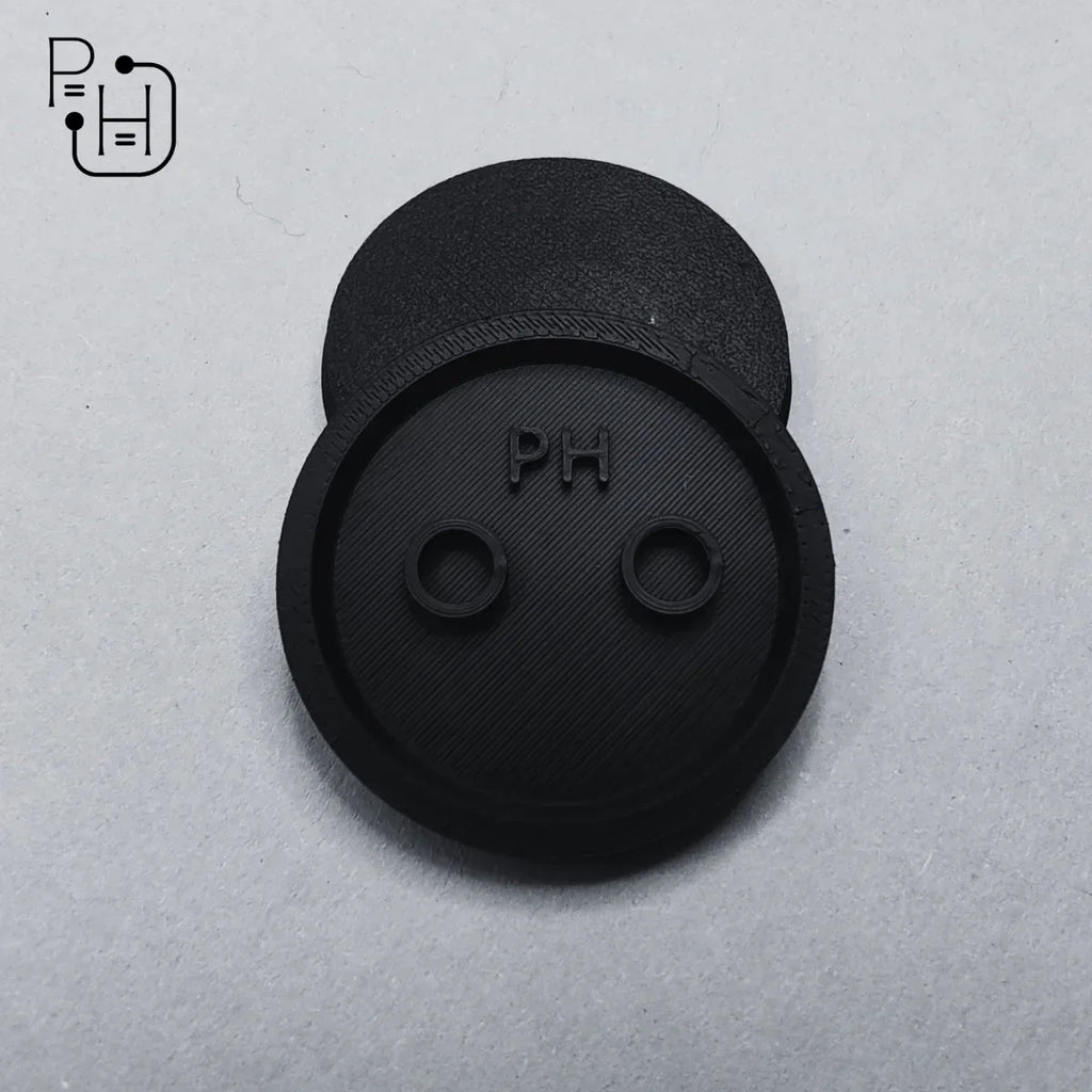 Black 3D printed wargaming base with PH logo and two circular slots, textured surface for hobby miniatures