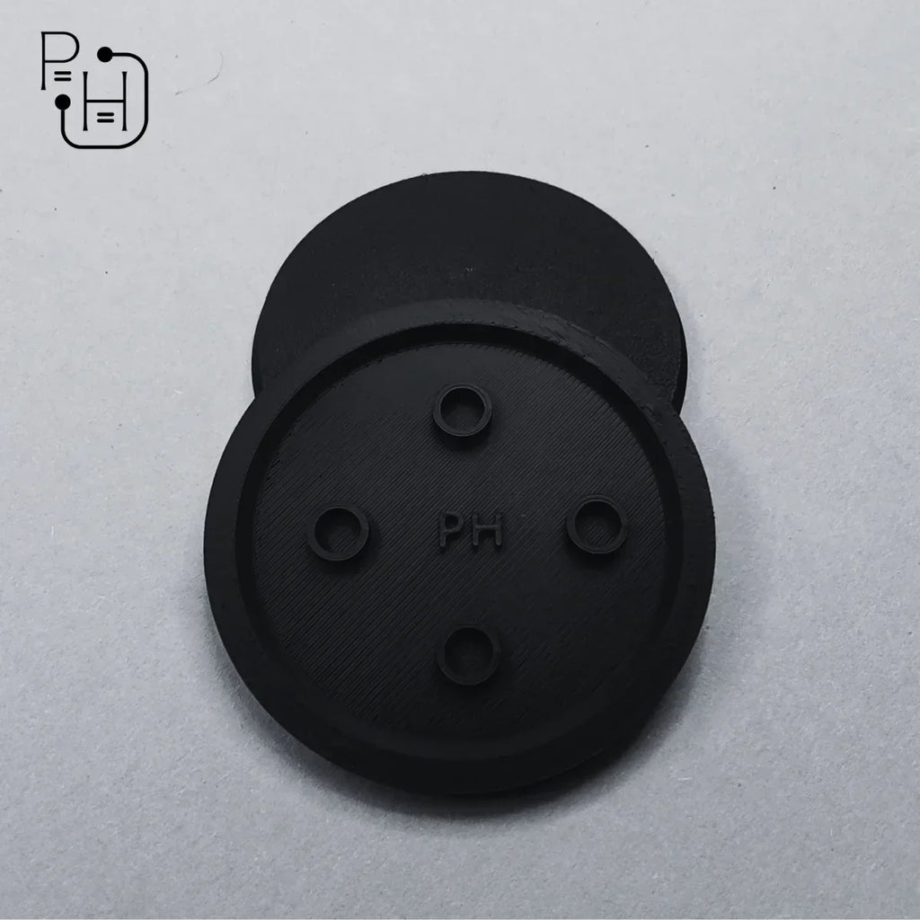 Black 3D printed wargaming bases with PH logo and four pin holes for miniatures