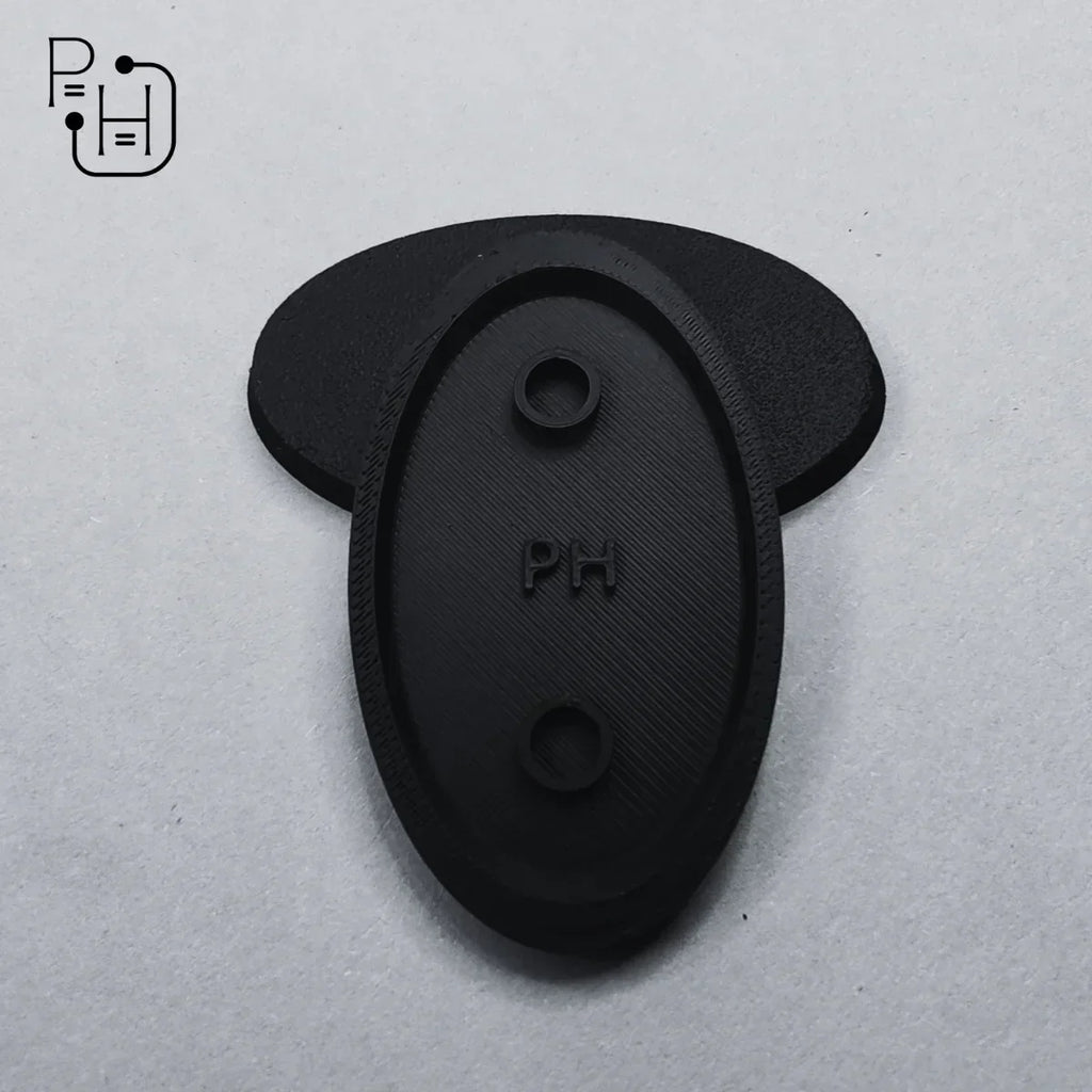 Black 3D printed wargaming base with PH logo, textured surface, and mounting holes for miniatures