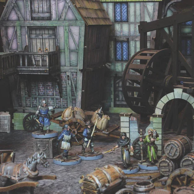 Painted medieval wargaming miniatures with spears, axes, and scrolls for tabletop battles