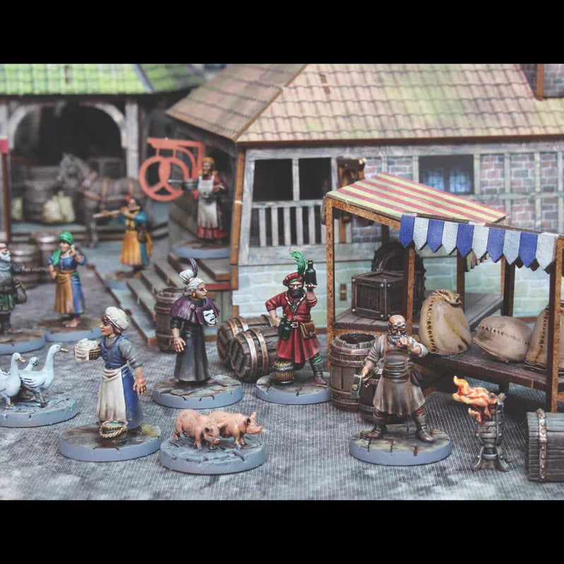 Medieval market scene with painted wargaming miniatures, barrels, pigs, and vendors for hobby enthusiasts